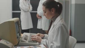 Woman working with an old computer